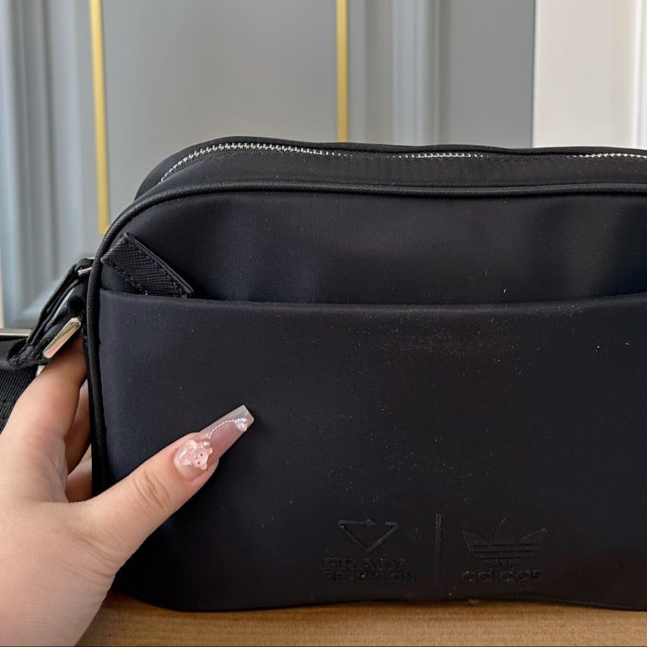 TRIANGLE LOGO CROSSBODY BAG 25 IN BLACK RE-NYLON