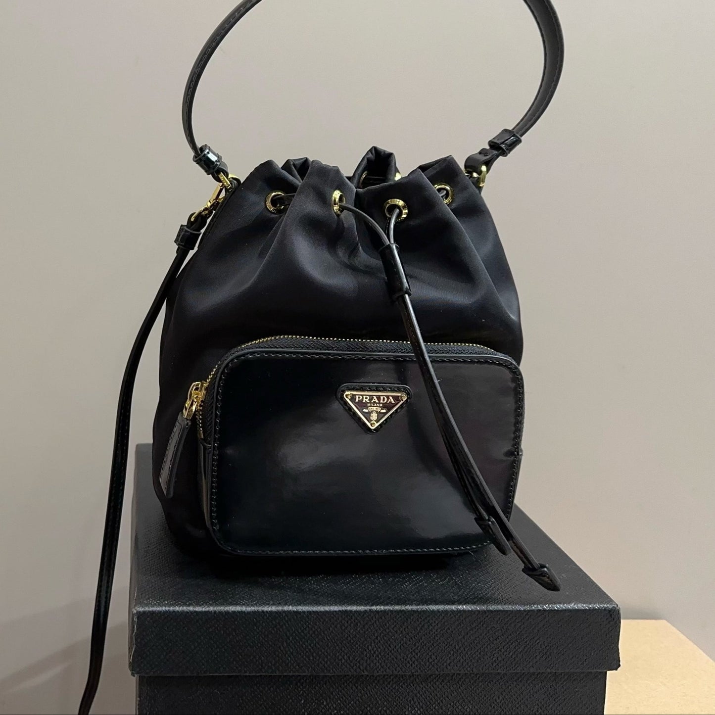 BUCKET BAG 22 IN BLACK RE-NYLON AND CALFSKIN HANDLE