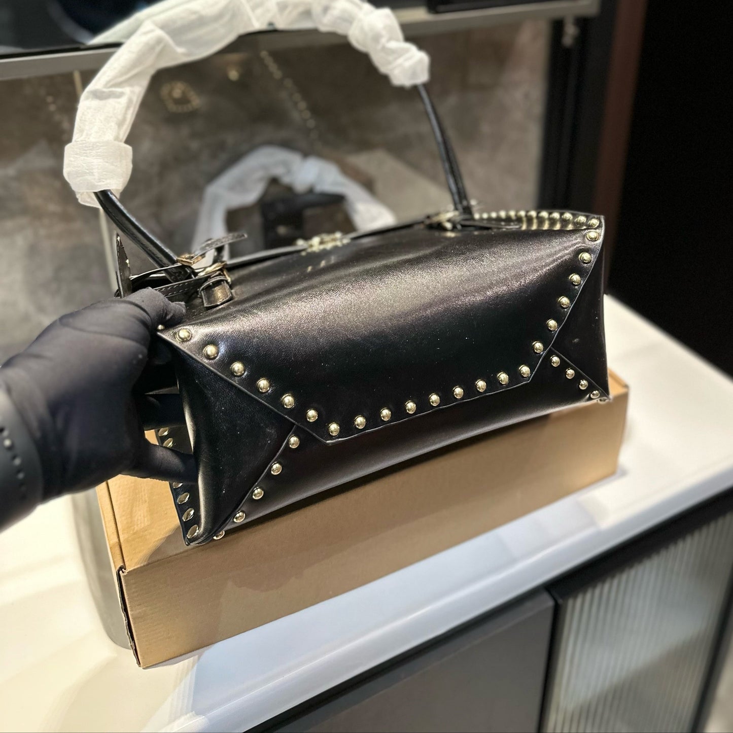 STUDDED TOP HANDLE BAG 33 IN BLACK SMOOTH CALFSKIN