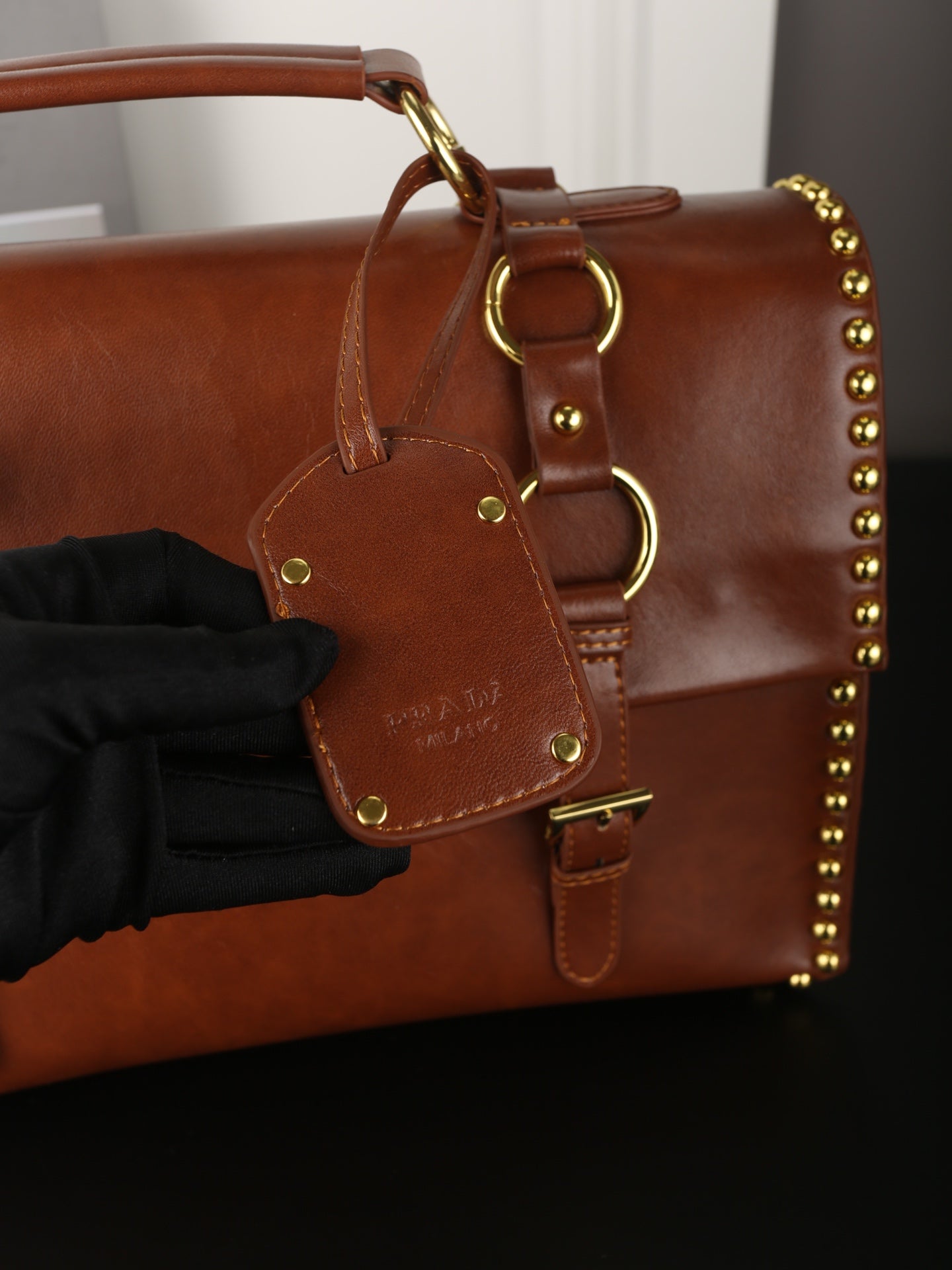 STUDDED BRIEFCASE 34 IN BROWN SHINY SMOOTH CALFSKIN
