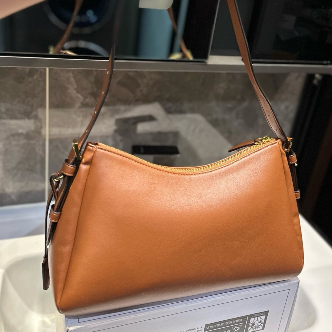 TRIANGLE LOGO HOBO BAG 34 IN BROWN SMOOTH CALFSKIN