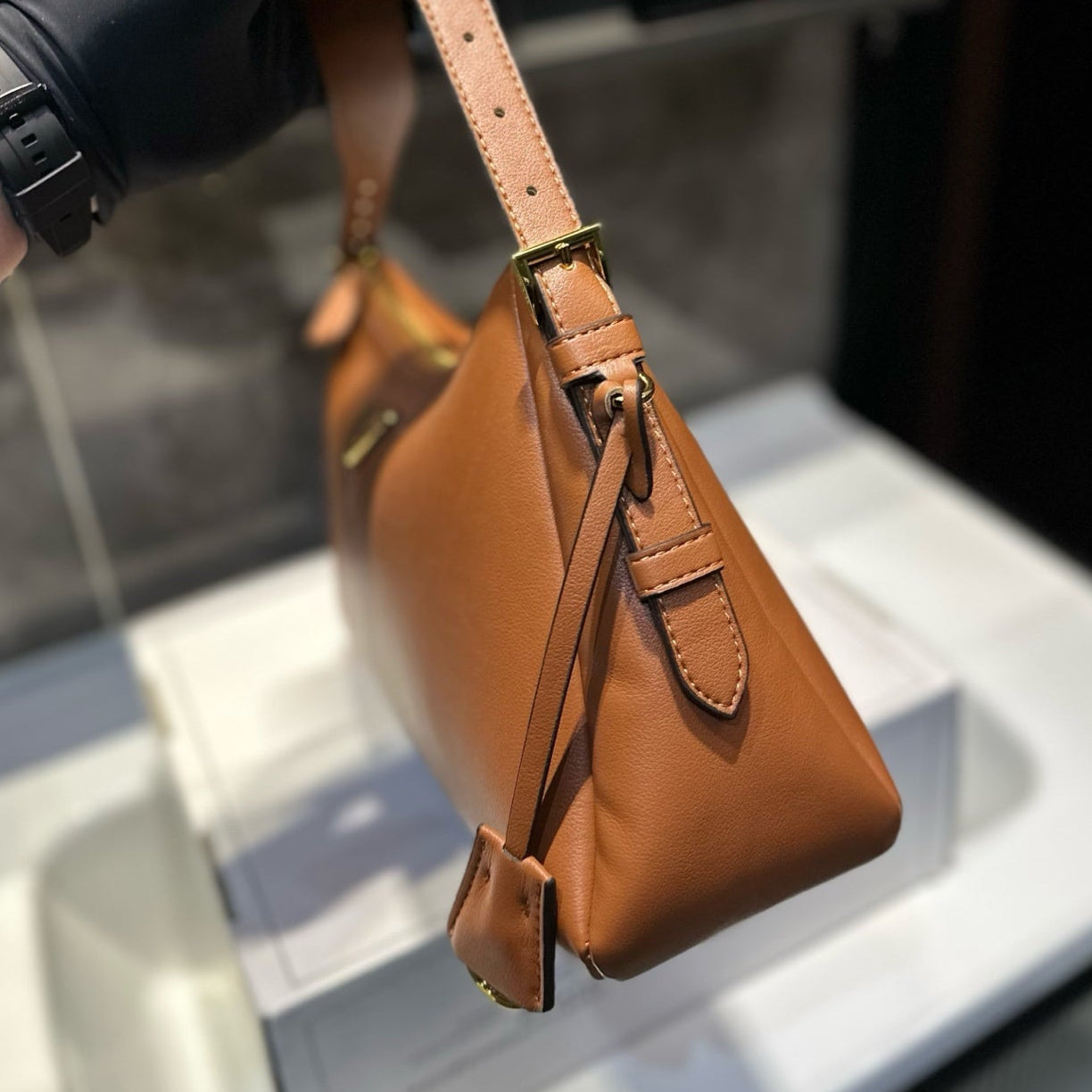 TRIANGLE LOGO HOBO BAG 34 IN BROWN SMOOTH CALFSKIN