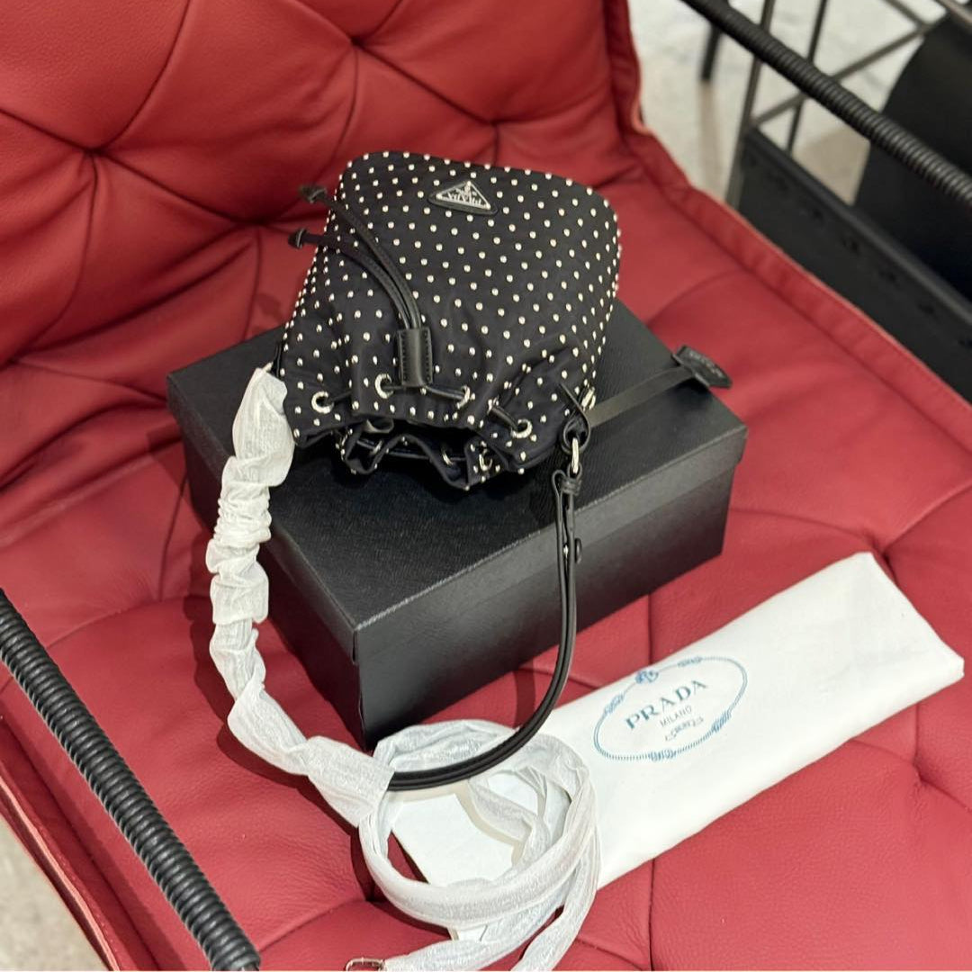 STUDDED DRAWSTRING BUCKET BAG 20 IN BLACK RE-NYLON MIX CALFSKIN